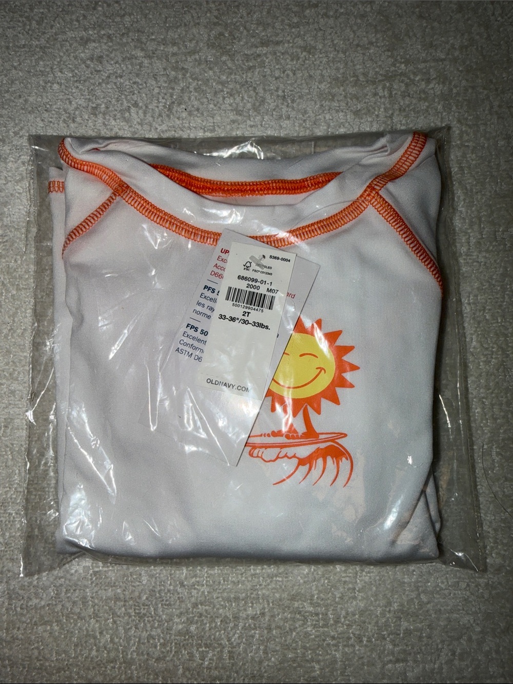 White Rash Guard with Orange Sun Graphic